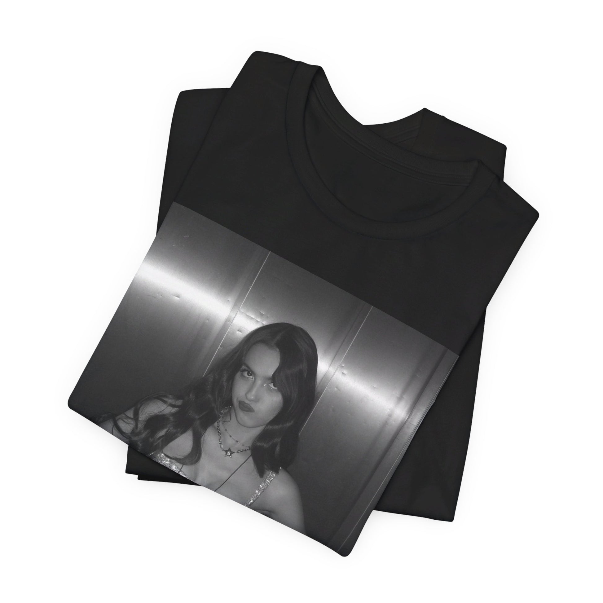 A black graphic t-shirt featuring a black and white portrait photo of Olivia Rodrigo.