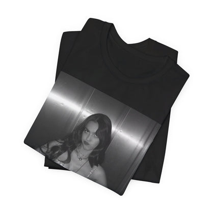 A black graphic t-shirt featuring a black and white portrait photo of Olivia Rodrigo.