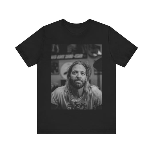 A black graphic t-shirt featuring a tribute graphic for Taylor Hawkins of Foo Fighters.