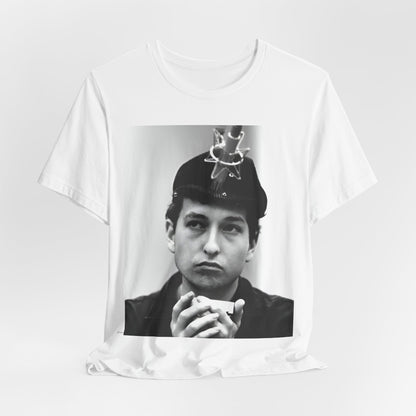 A black graphic t-shirt featuring a graphic of Bob Dylan in an acoustic session setting, possibly with his guitar.