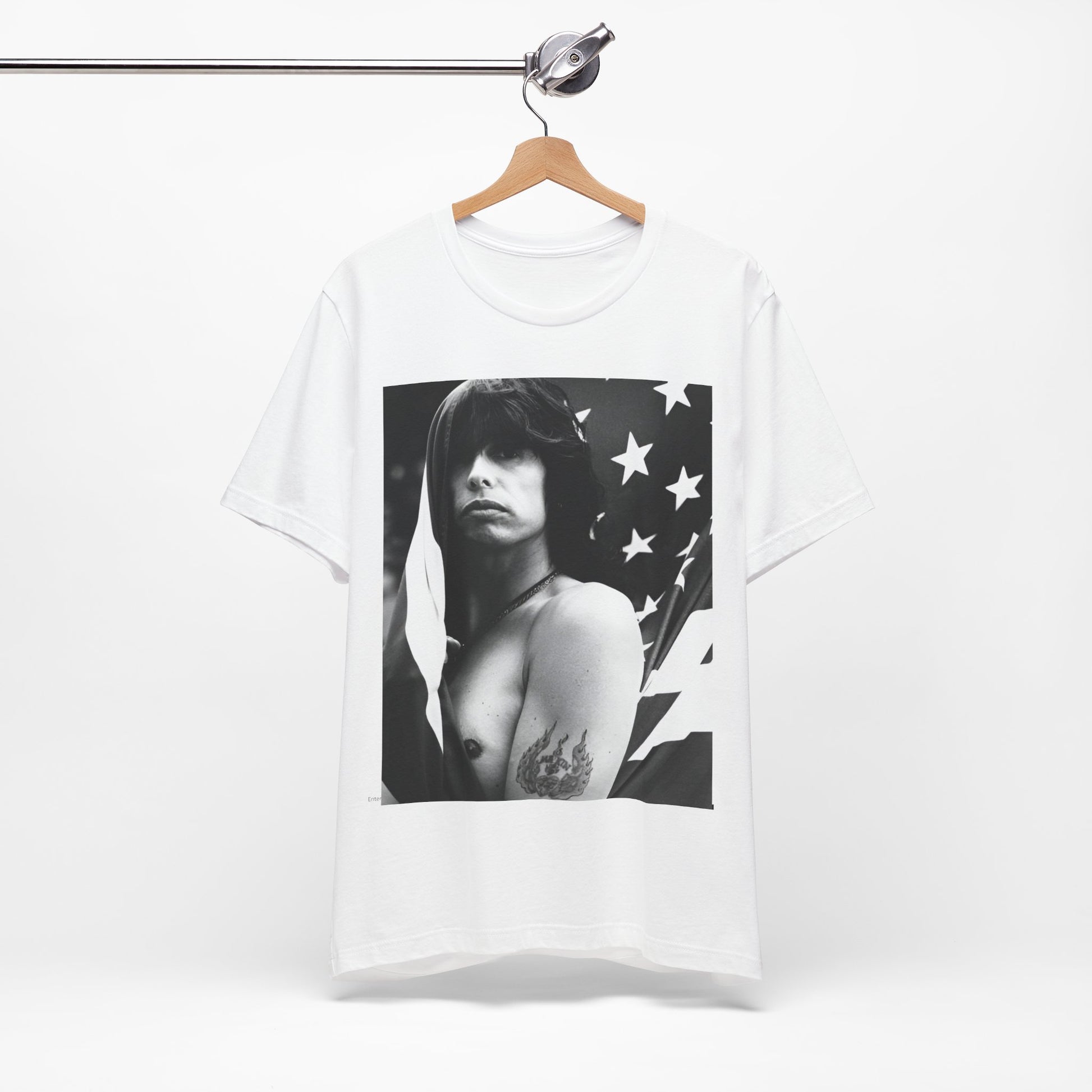 A black graphic t-shirt featuring a retro 70s-style illustration or photo of Aerosmith, integrated with elements of the American flag.
