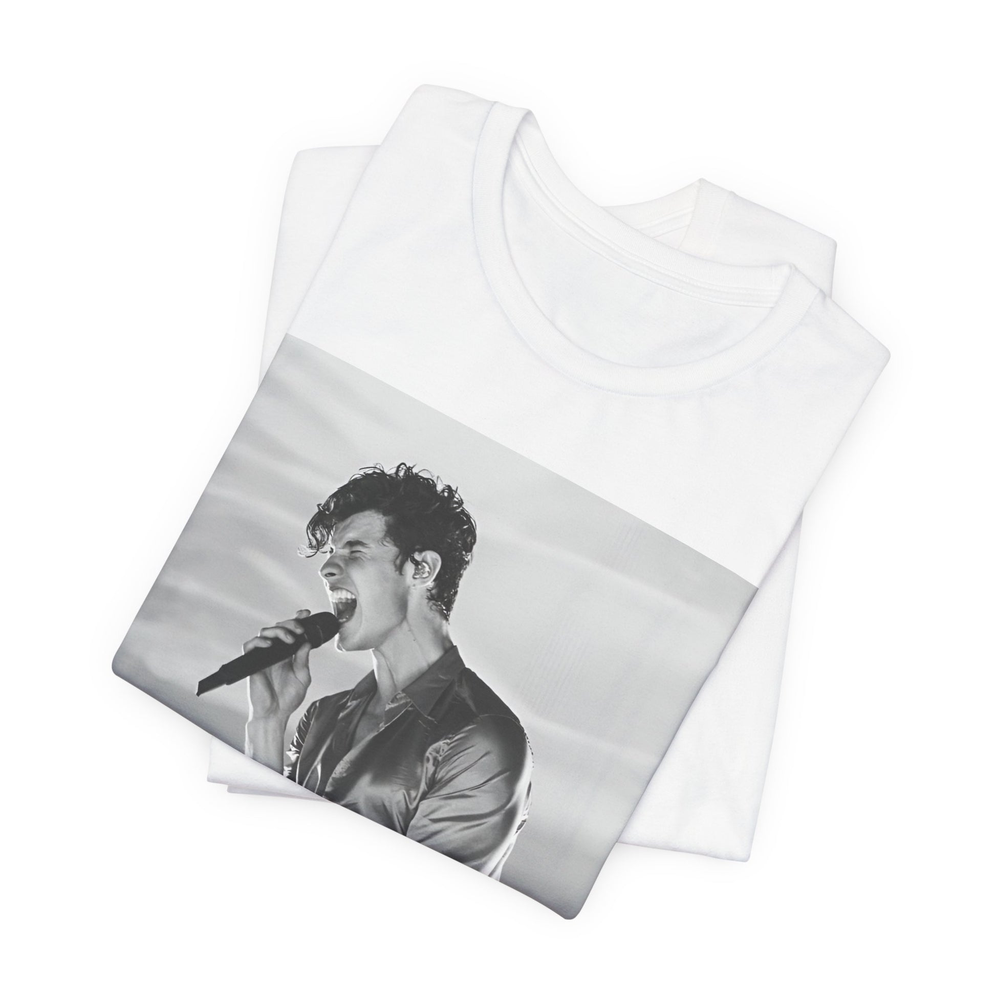 A black graphic t-shirt featuring a black and white graphic or photo of Shawn Mendes as a dreamy pop star.