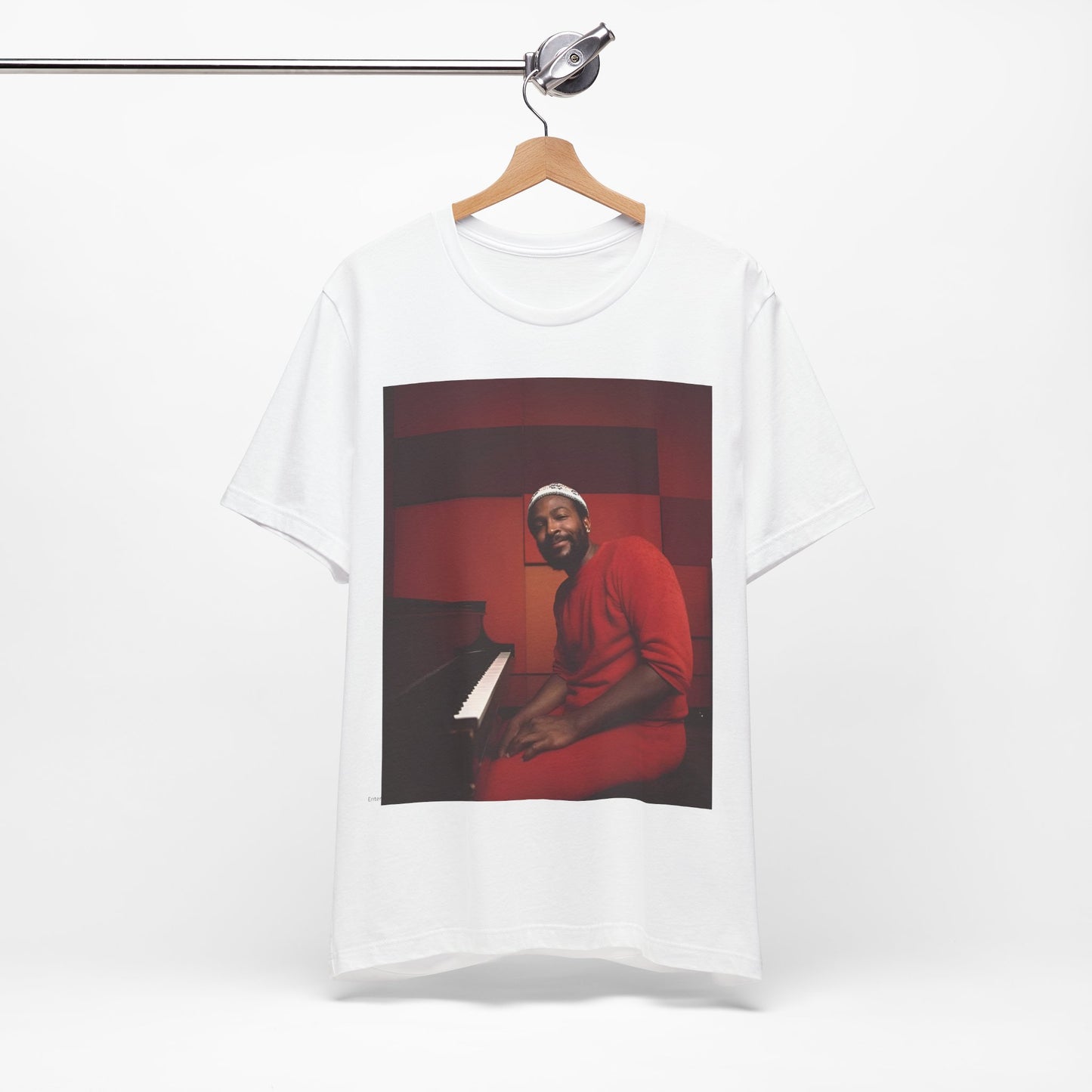 A black graphic t-shirt featuring a retro photo of Marvin Gaye playing the piano.