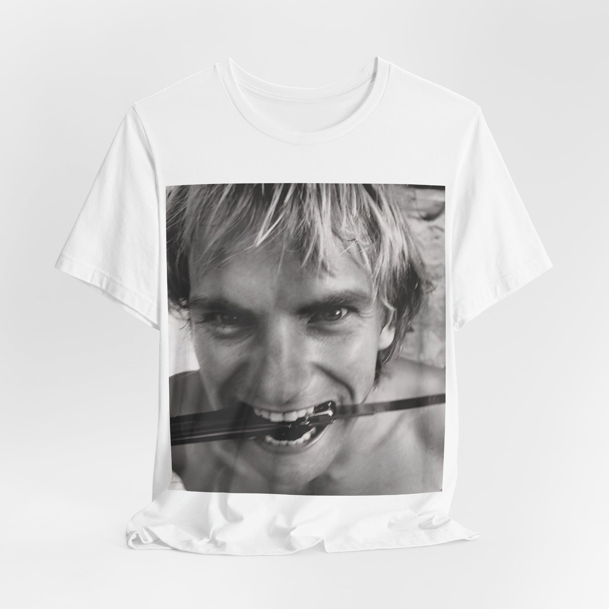 A black graphic t-shirt featuring a wild photo graphic of Sting.