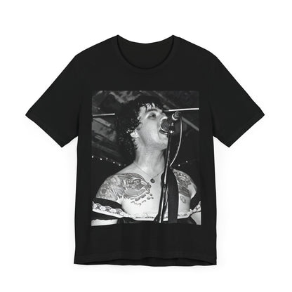 A black graphic t-shirt featuring a black and white graphic or photo of Green Day performing live on stage.
