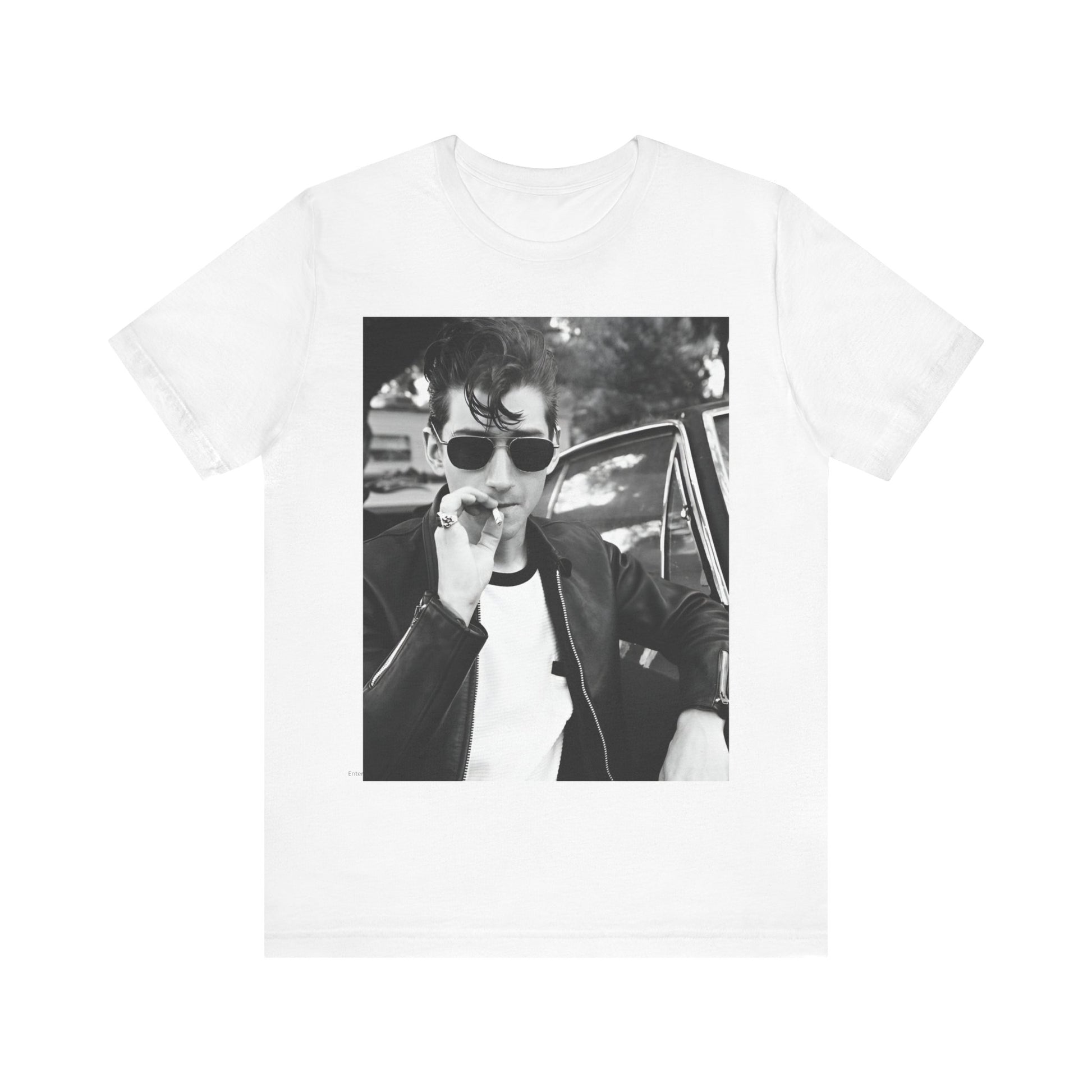 A black graphic t-shirt featuring a classic rock-style graphic of the Arctic Monkeys, possibly with band members in a stylized design.