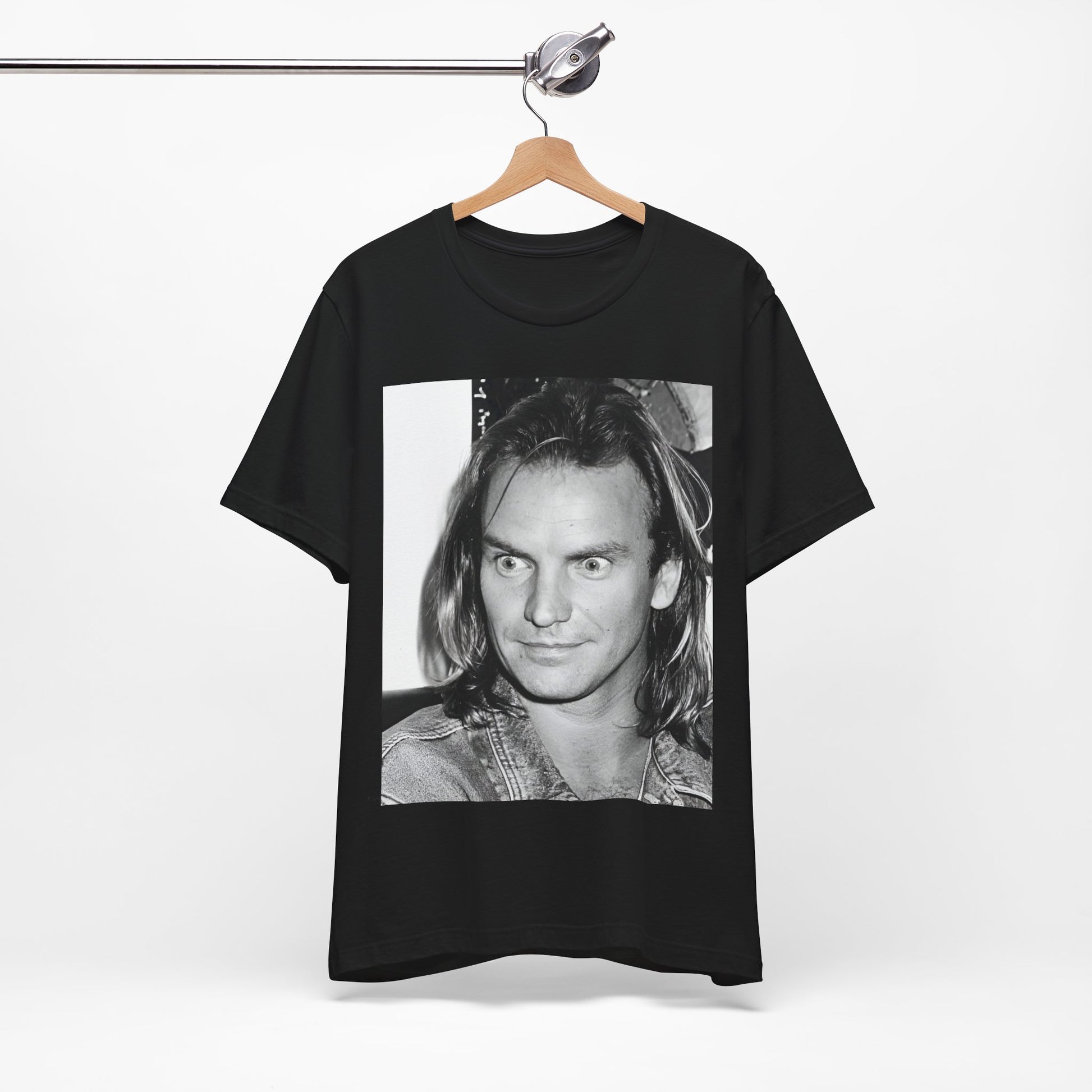 A black graphic t-shirt featuring a retro graphic related to Sting's 'Synchronicity' album era.