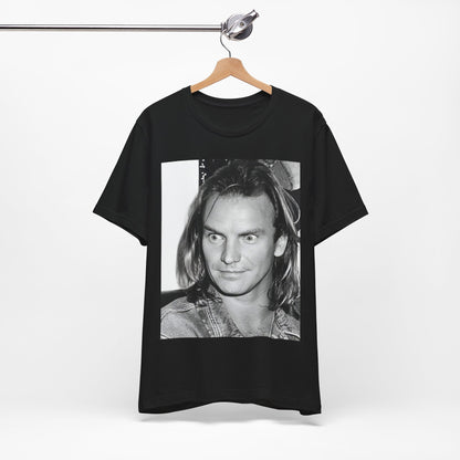 A black graphic t-shirt featuring a retro graphic related to Sting's 'Synchronicity' album era.