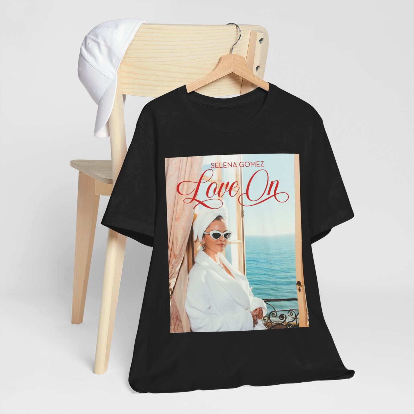 A black graphic t-shirt featuring a graphic related to Selena Gomez's 'Love On' song.