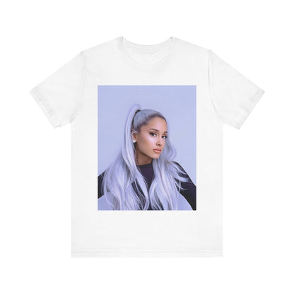 A black graphic t-shirt featuring a stylized graphic of Ariana Grande, possibly with a crown or 'Pop Queen' text, emphasizing her iconic status.