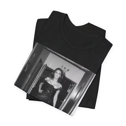 A black graphic t-shirt featuring a black and white graphic of Miley Cyrus in a cool pop rock style.