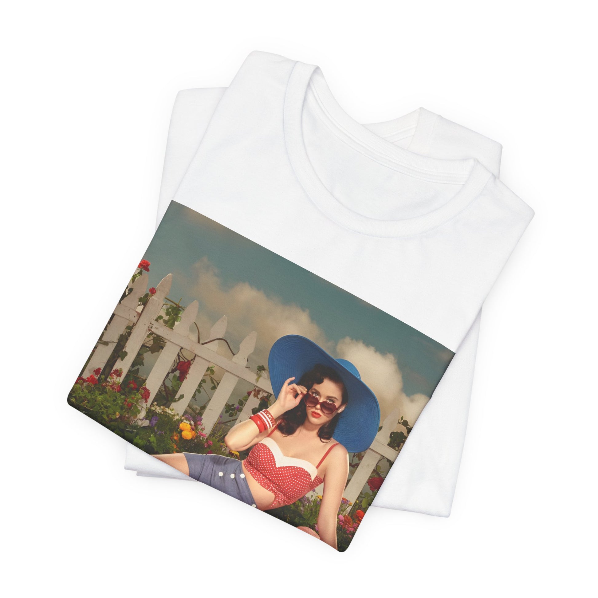 A black graphic t-shirt featuring a graphic related to Katy Perry's "California Gurls" song, with beach vibes.