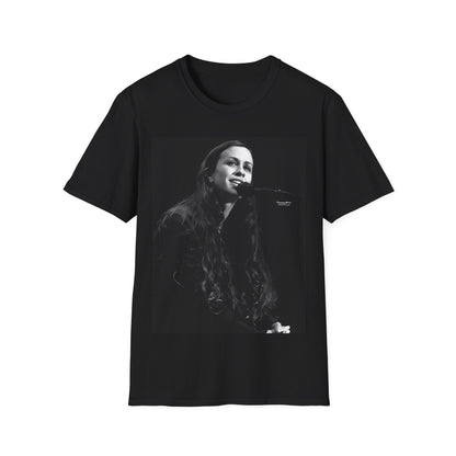 A black graphic t-shirt featuring a 90s-style graphic of Alanis Morissette on tour, possibly showing her performing or with tour elements.