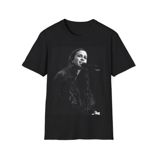 A black graphic t-shirt featuring a 90s-style graphic of Alanis Morissette on tour, possibly showing her performing or with tour elements.