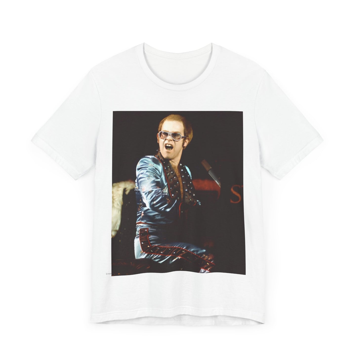 A black graphic t-shirt featuring a retro graphic related to Elton John's 'Rocket Man' song or era.