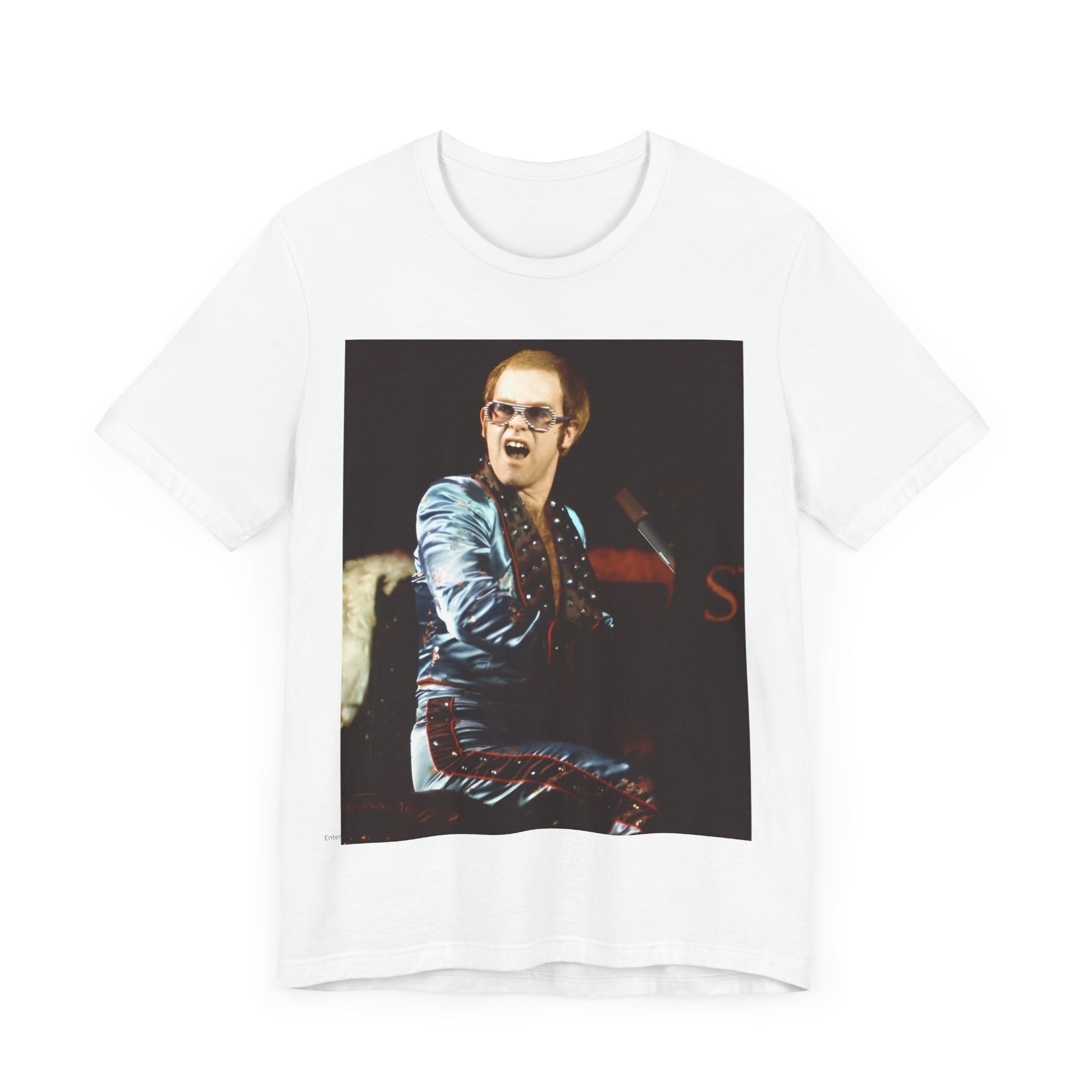 A black graphic t-shirt featuring a retro graphic related to Elton John's 'Rocket Man' song or era.