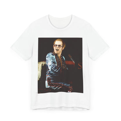 A black graphic t-shirt featuring a retro graphic related to Elton John's 'Rocket Man' song or era.