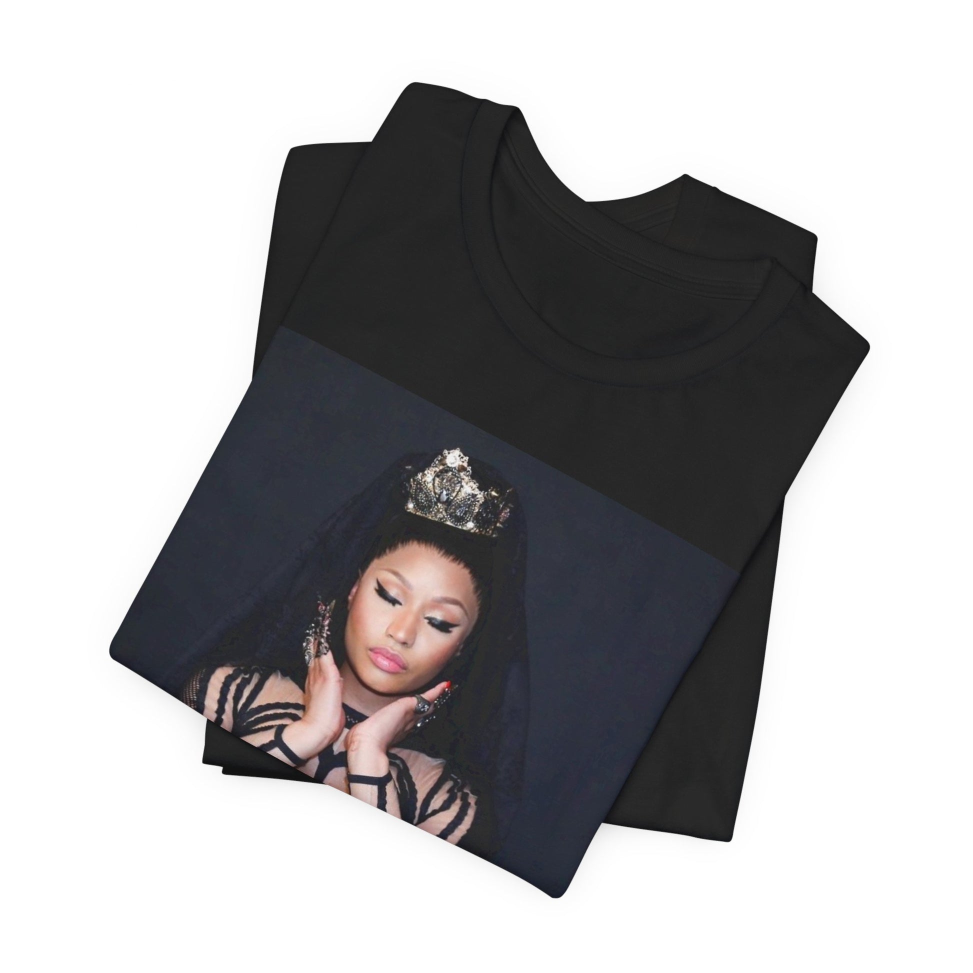 A black graphic t-shirt featuring a vintage graphic of Nicki Minaj as the Queen of Rap.