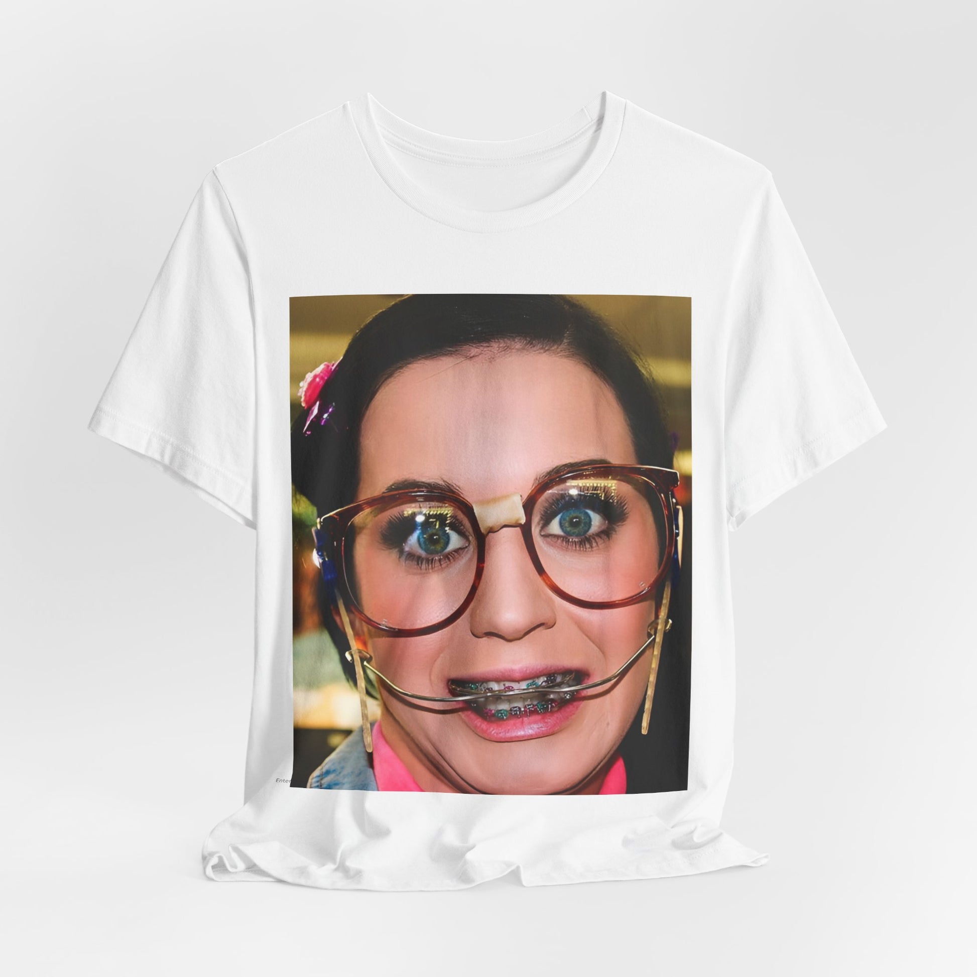 A black graphic t-shirt featuring a graphic related to Katy Perry's "I Kissed A Girl" song or era.