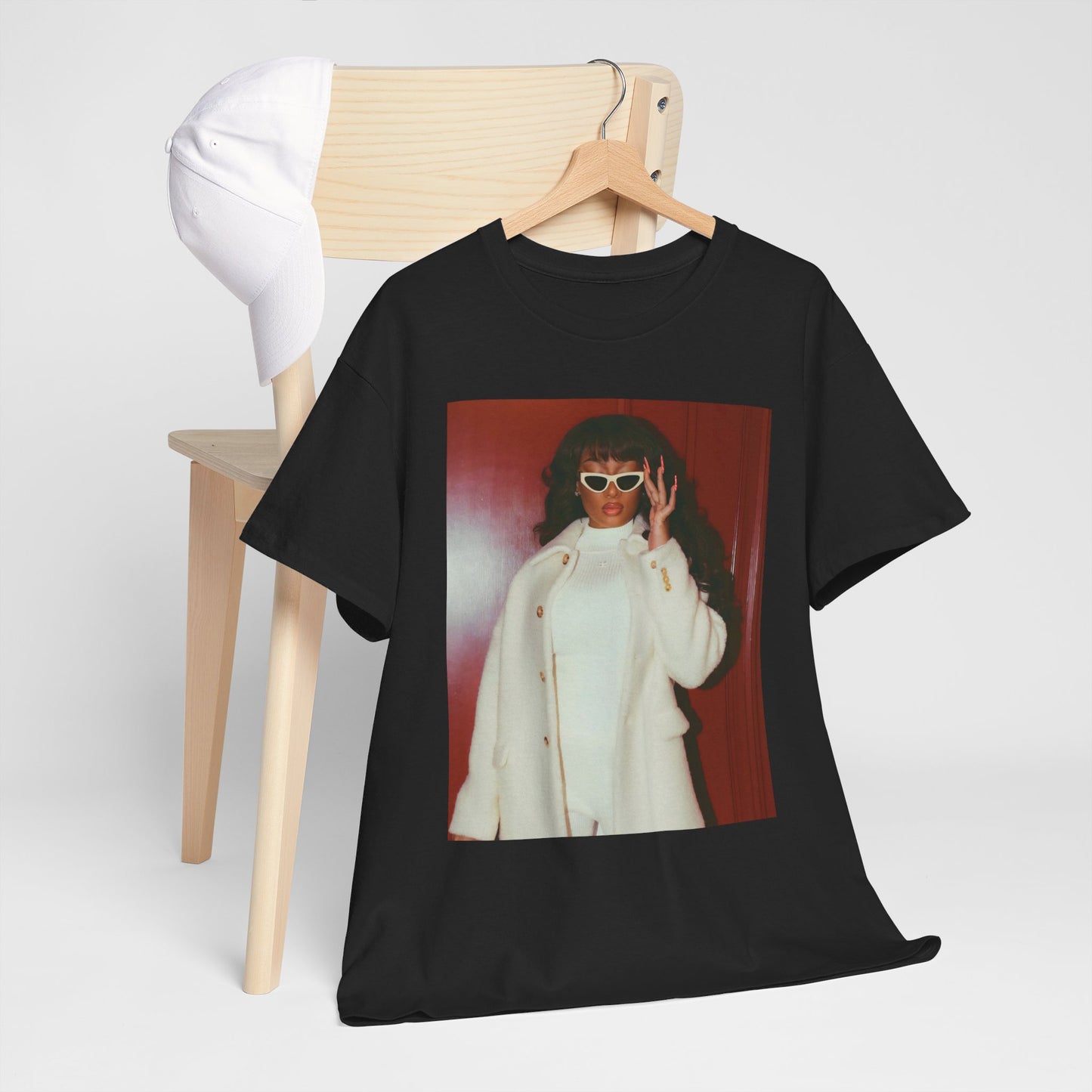 A black graphic t-shirt featuring a glamorous graphic of Megan Thee Stallion.