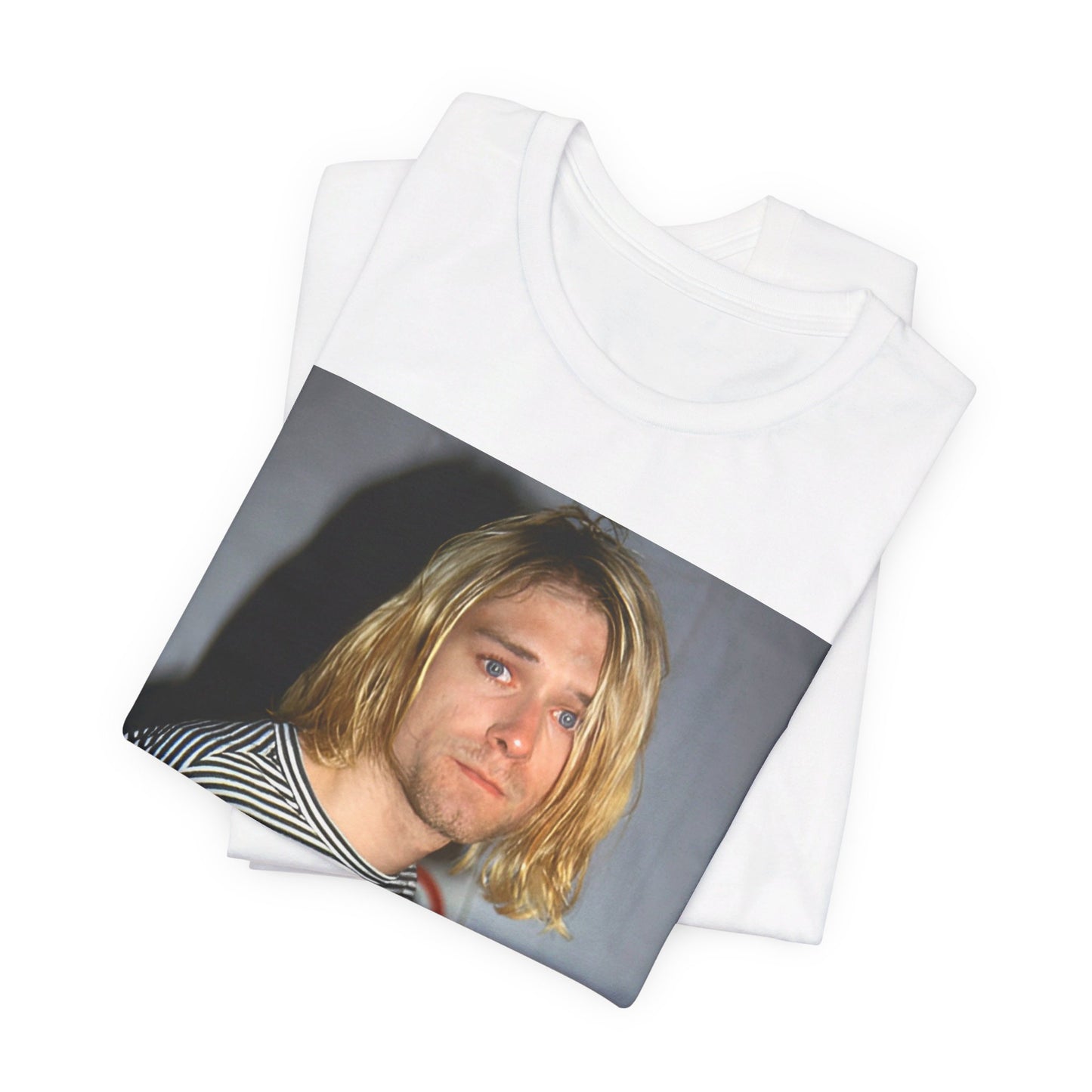 A black graphic t-shirt featuring a 90s photo portrait of Kurt Cobain from Nirvana.