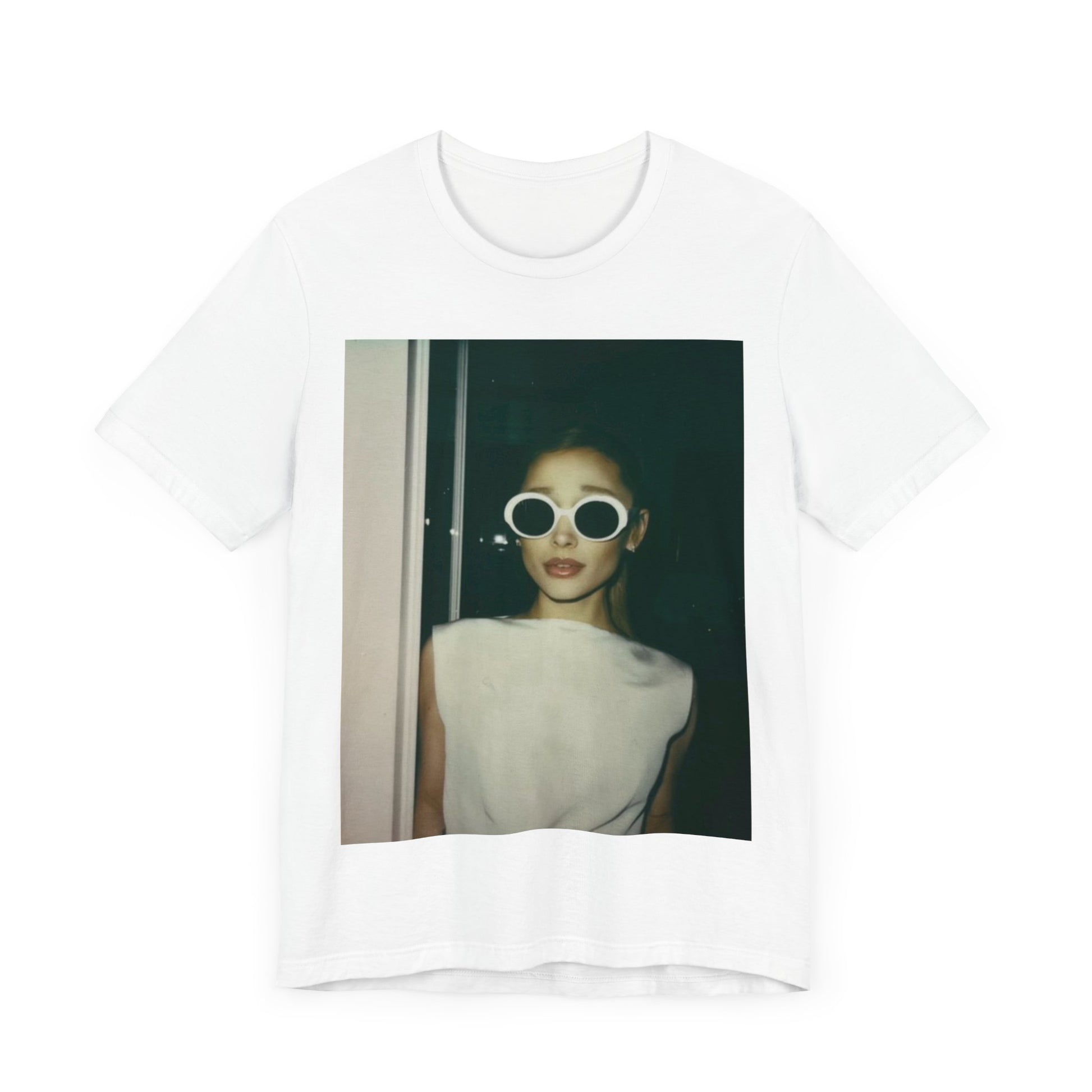 A black graphic t-shirt featuring a retro Polaroid-style photo of Ariana Grande.