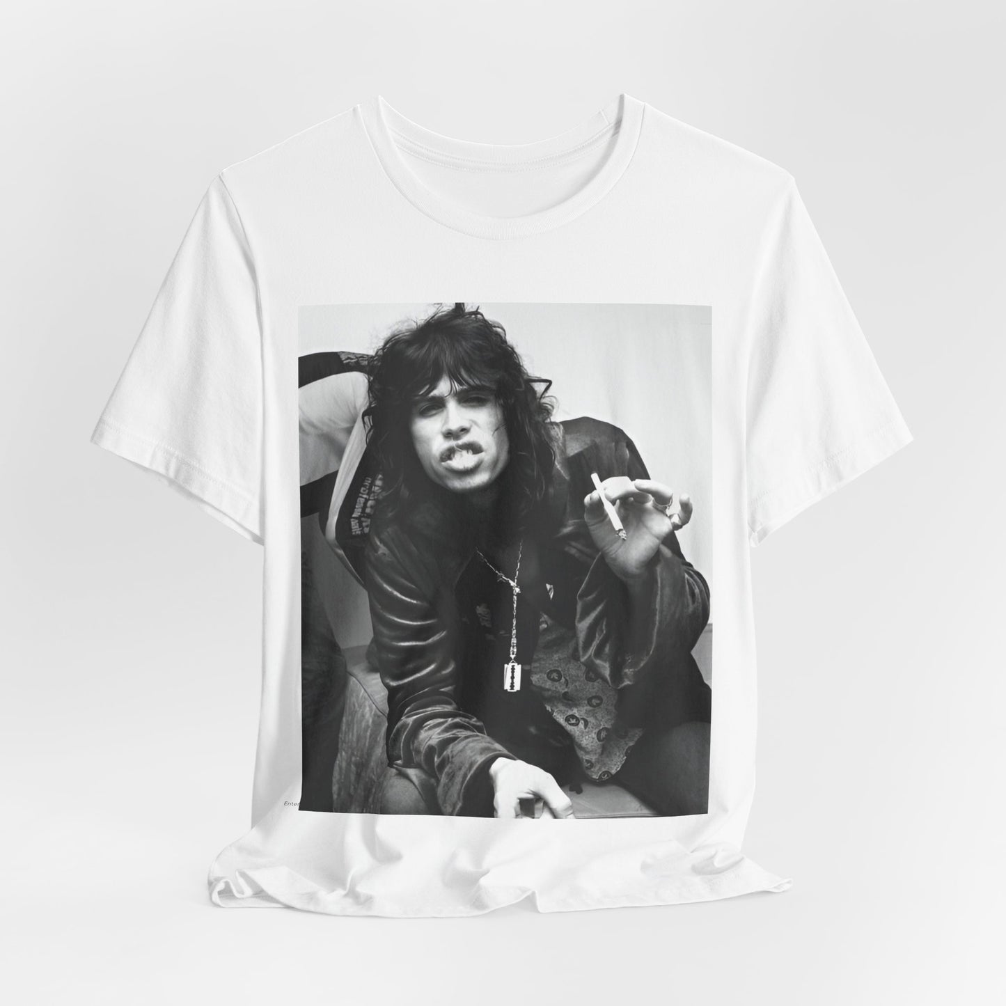 A black graphic t-shirt featuring a retro 70s photo of Aerosmith band members lounging in leather, exuding a cool, classic rock vibe.