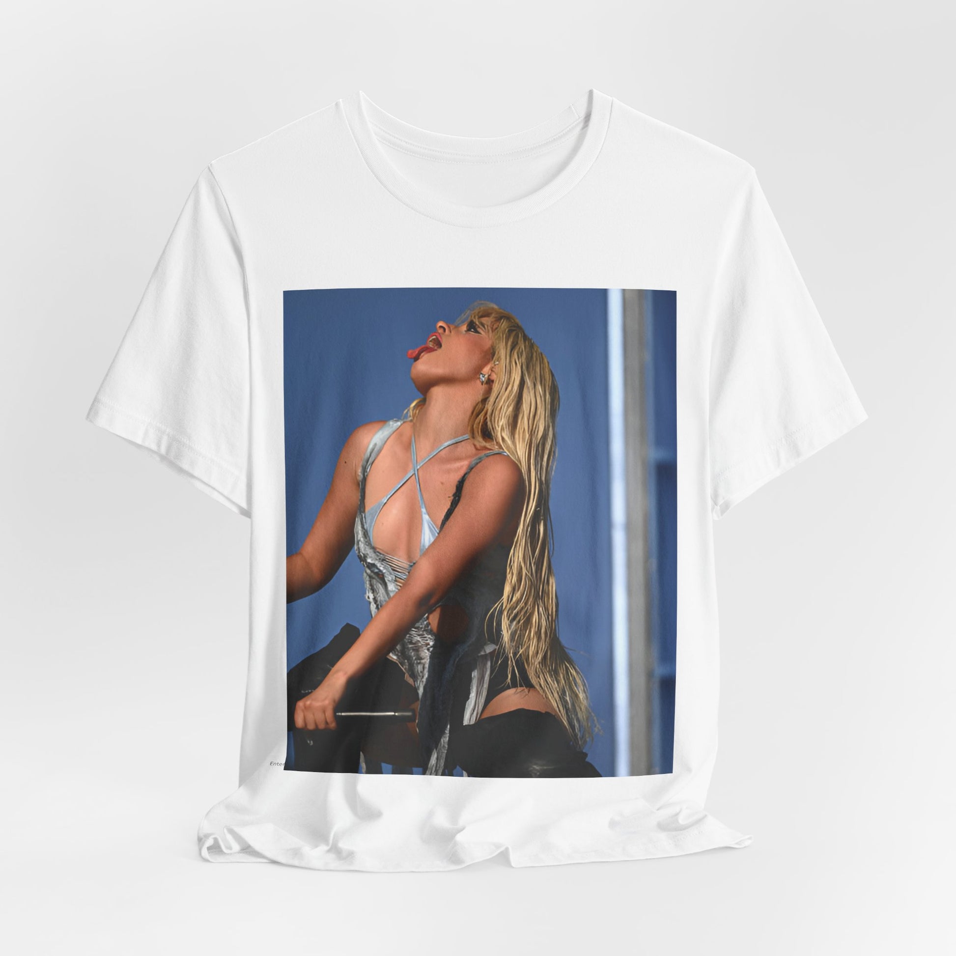 A black graphic t-shirt featuring a dynamic graphic or photo of Camila Cabello performing live on stage.