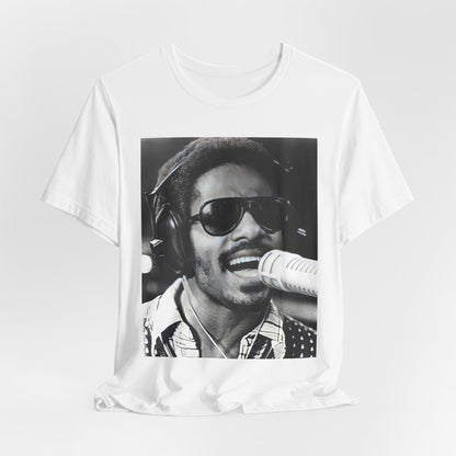 A black graphic t-shirt featuring a graphic of Stevie Wonder as a timeless visionary.
