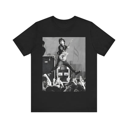 A black graphic t-shirt featuring a graphic of Billie Joe Armstrong from Green Day jumping on stage during a performance.
