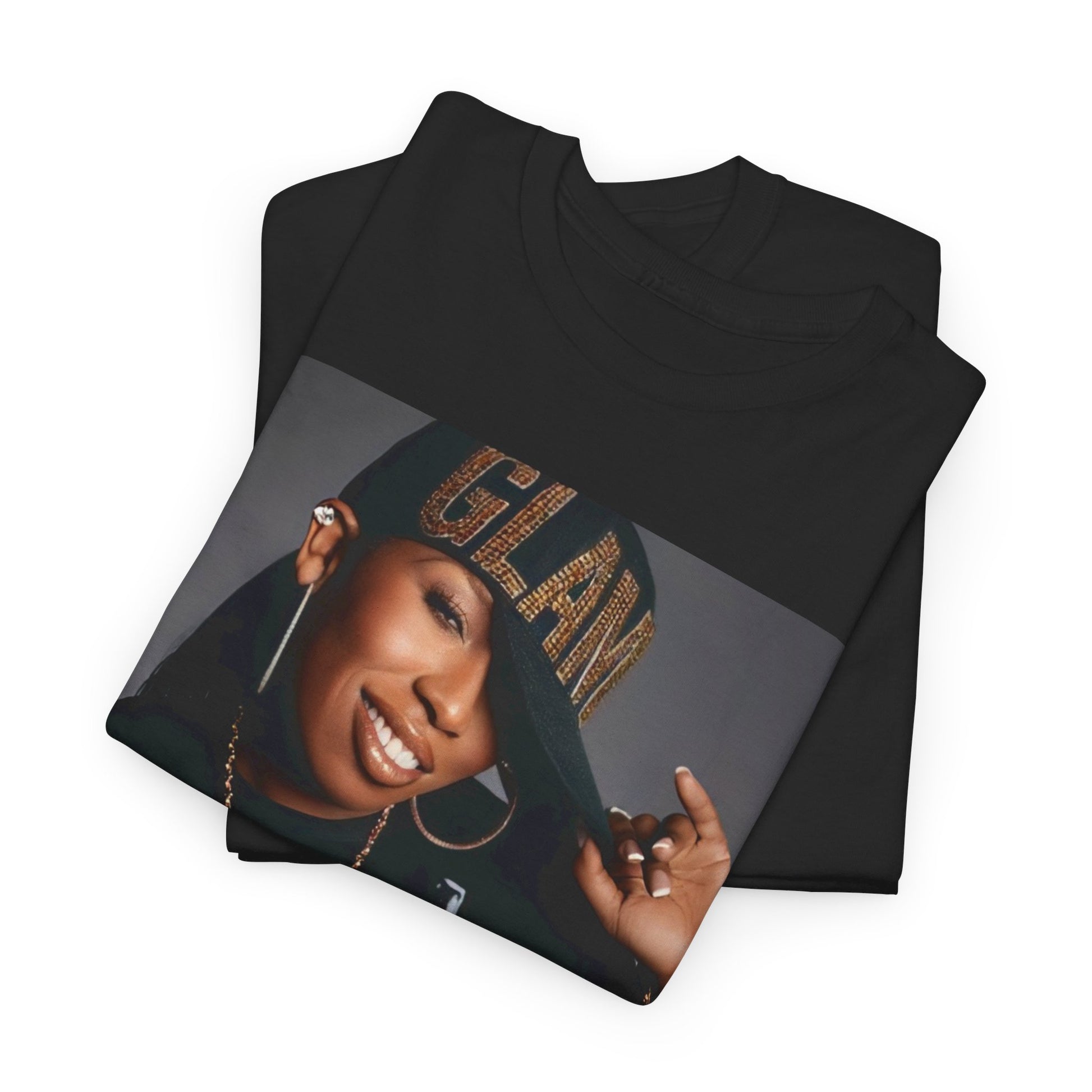 A black graphic t-shirt featuring a 90s graphic of Missy Elliott as a global rap phenomenon.