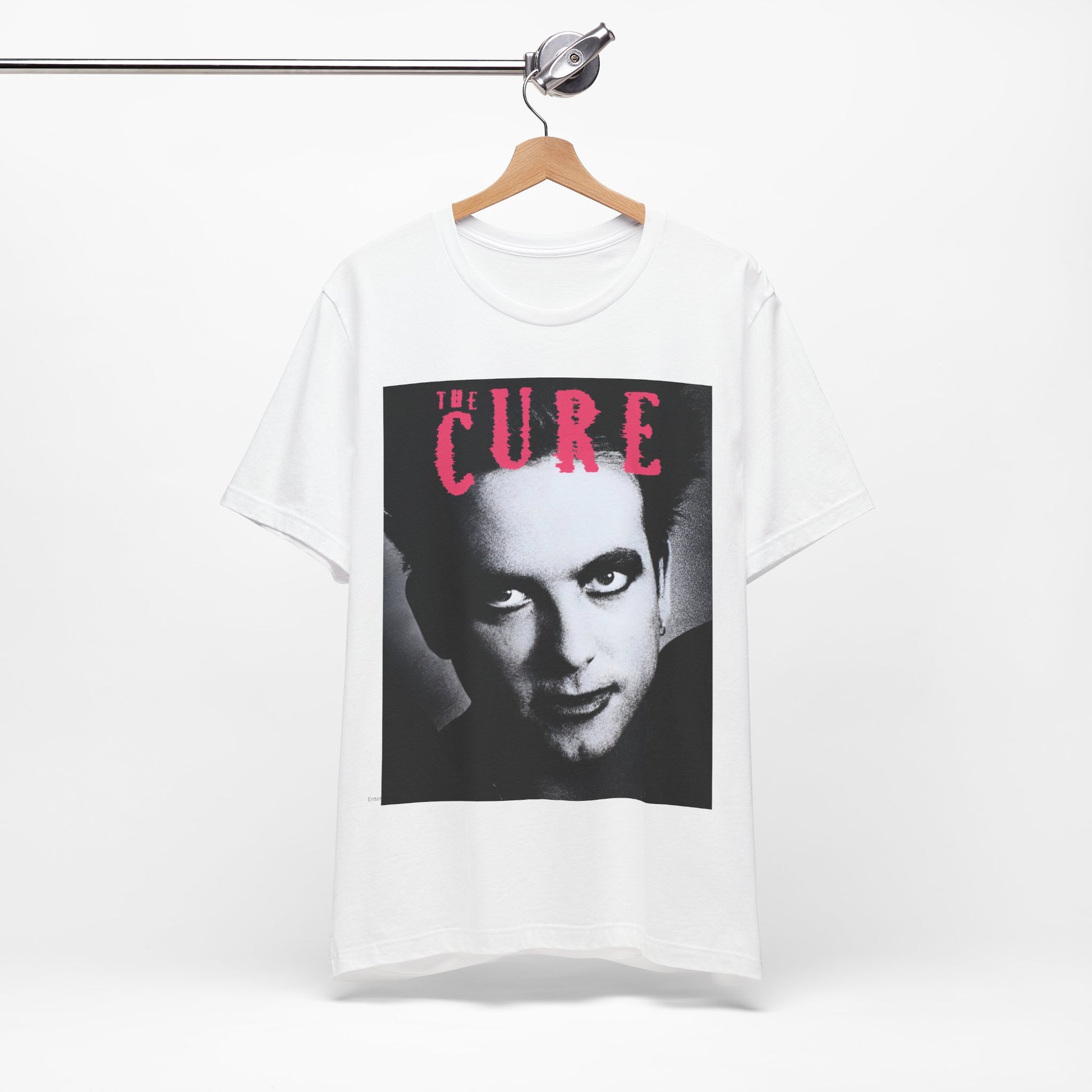 A black graphic t-shirt featuring an 80s post-punk aesthetic graphic of The Cure.