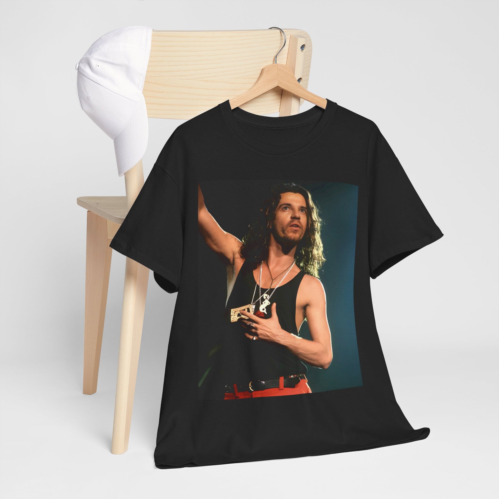 A black graphic t-shirt featuring a vintage 80s new wave graphic of INXS.