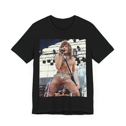 A black graphic t-shirt featuring a dynamic graphic or photo of Bon Jovi performing live on stage with a fierce intensity.
