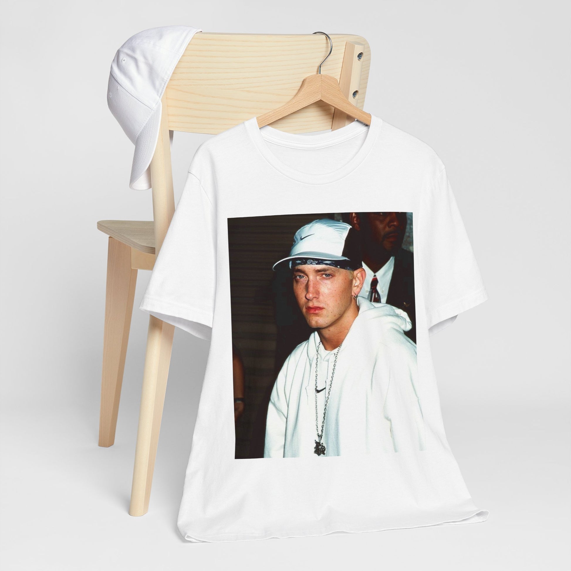 A black graphic t-shirt featuring a retro graphic or photo of Eminem in a backstage setting.