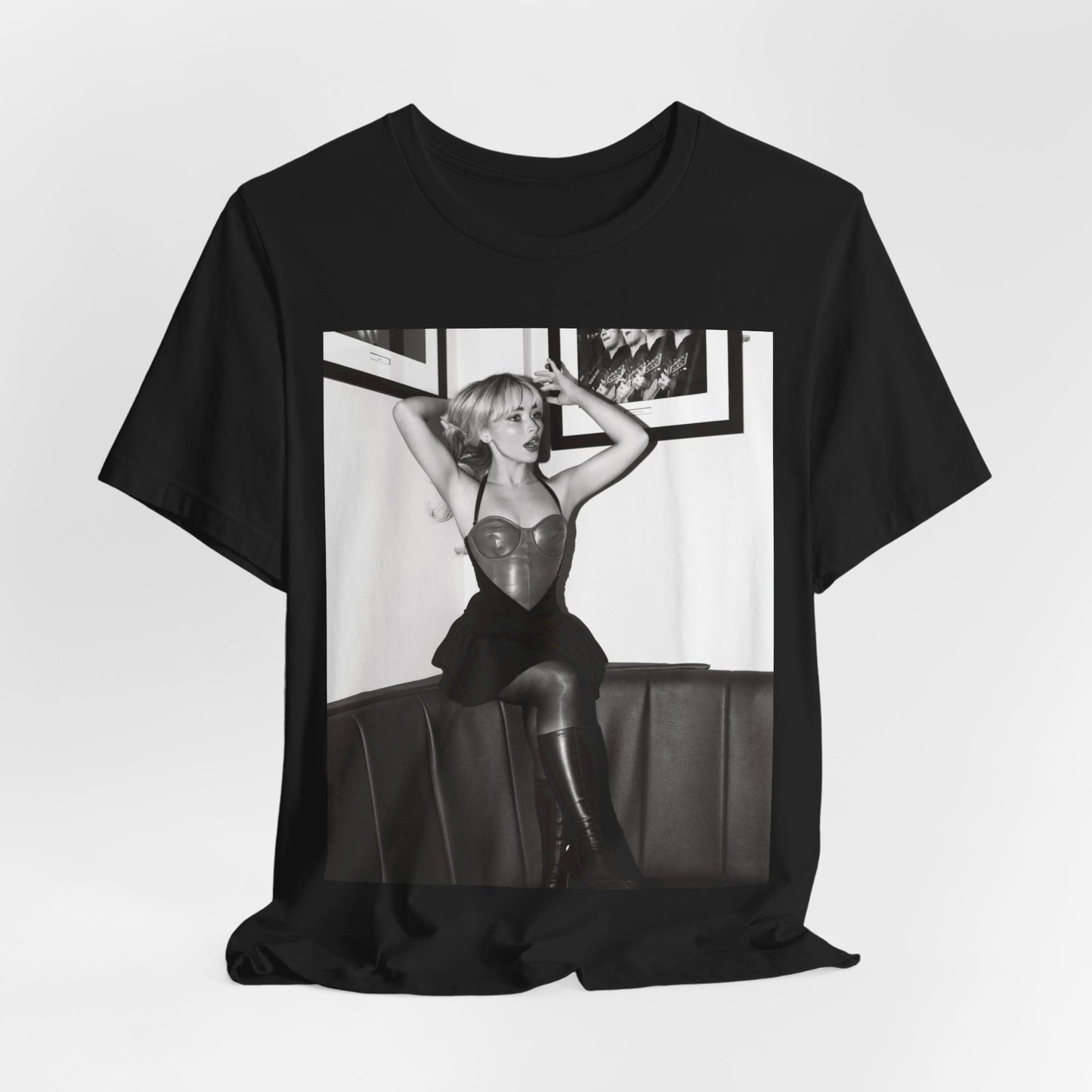 A black graphic t-shirt featuring a black and white graphic of Sabrina Carpenter as a pop princess.