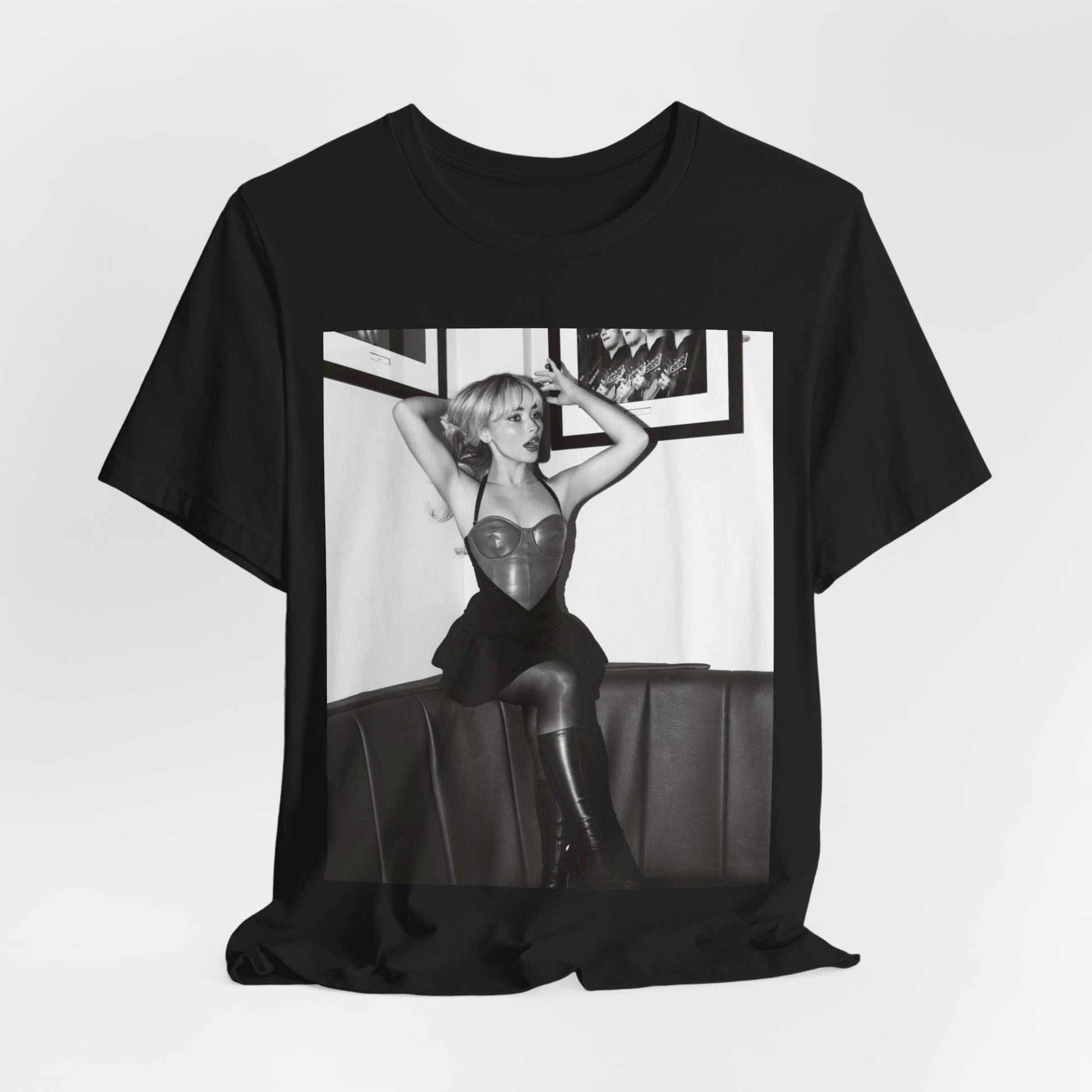 A black graphic t-shirt featuring a black and white graphic of Sabrina Carpenter as a pop princess.