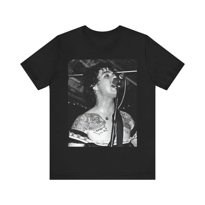 A black graphic t-shirt featuring a black and white graphic or photo of Green Day performing live on stage.