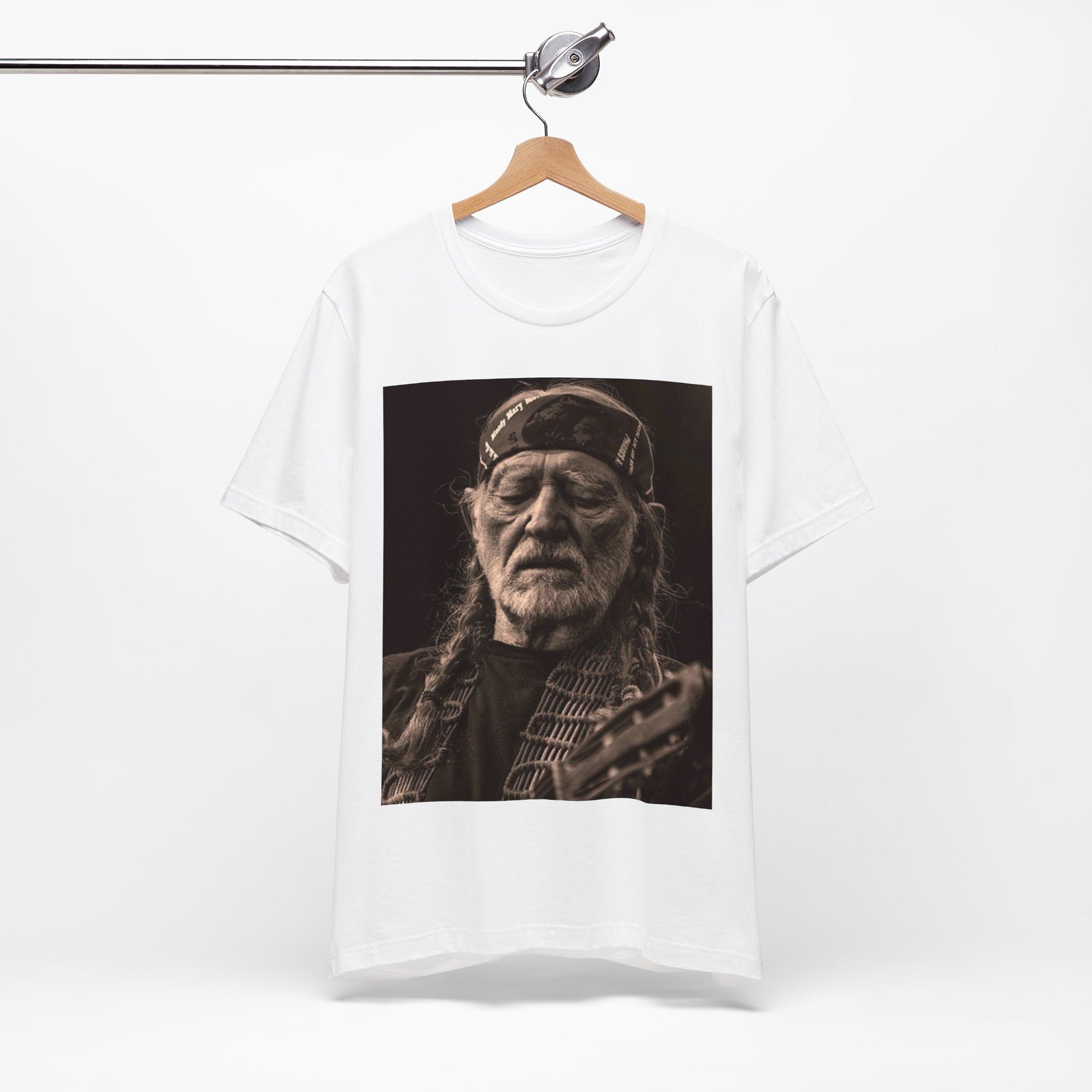 A black graphic t-shirt featuring a graphic of Willie Nelson with his iconic braids style.