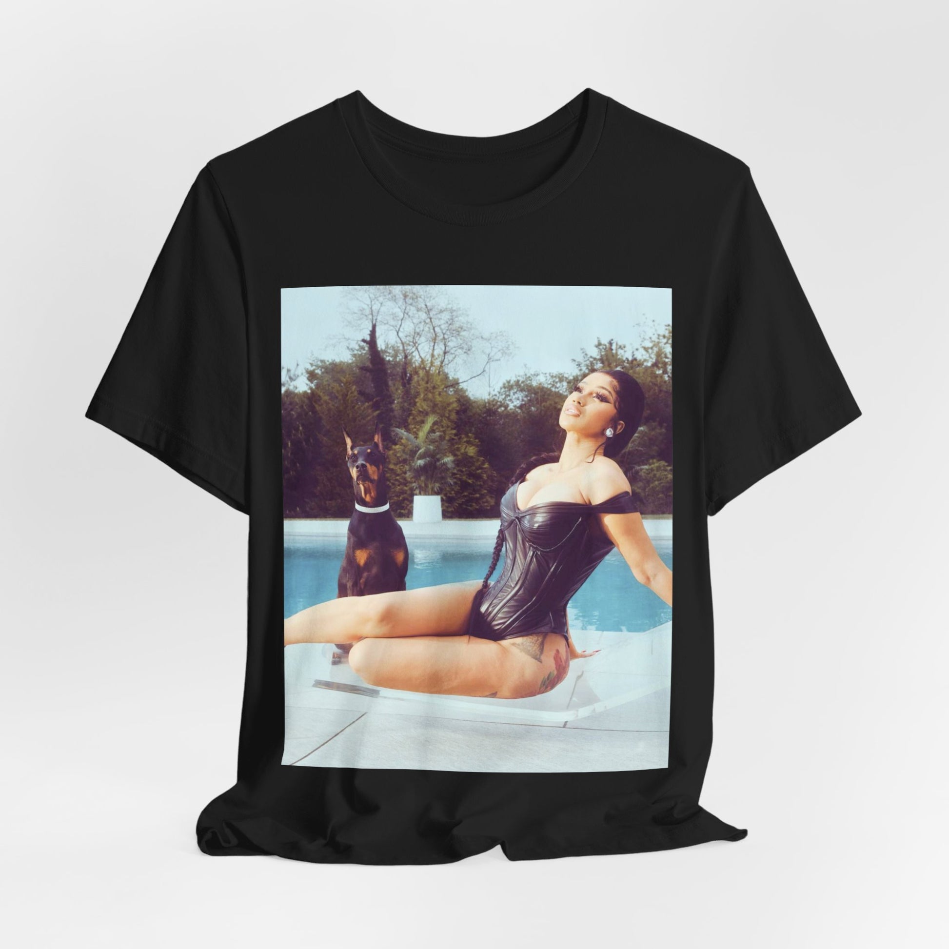 A black graphic t-shirt featuring a graphic related to Cardi B's 'I Like It' song, with bold pop culture elements.