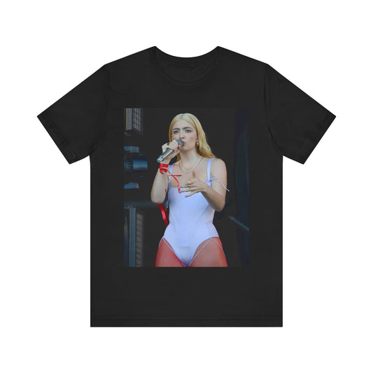 A black graphic t-shirt featuring a graphic or photo of Lorde performing on stage in a cool alternative music style.