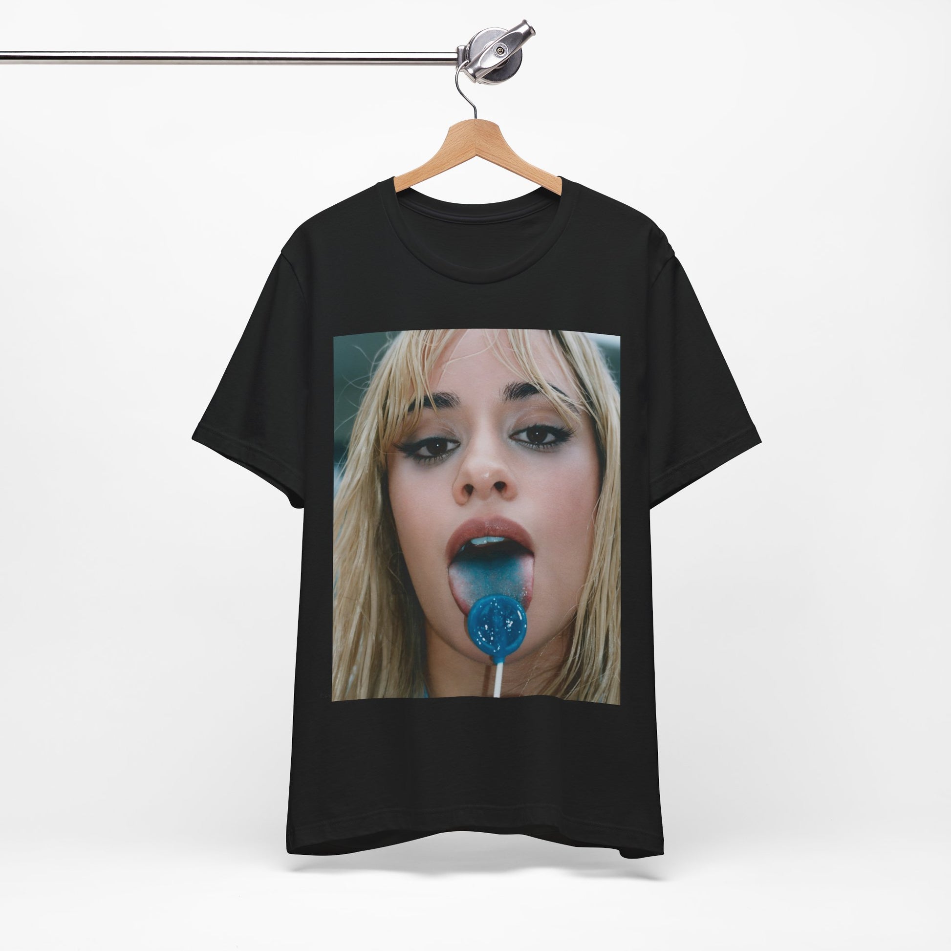 A black graphic t-shirt featuring a graphic related to Camila Cabello's C,XOXO album, with an aesthetic design.