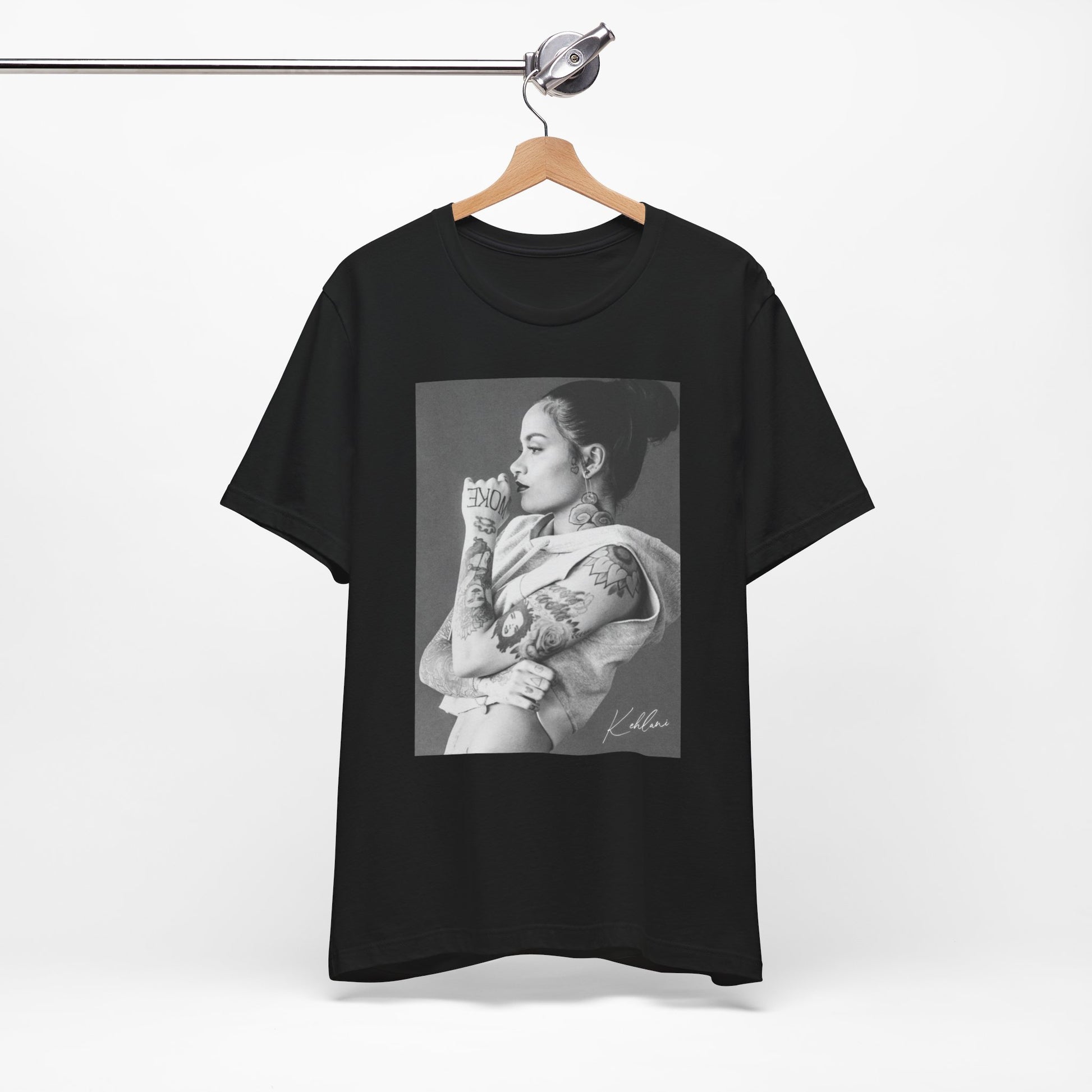 A black graphic t-shirt featuring a black and white, monochrome graphic or photo of Kehlani.