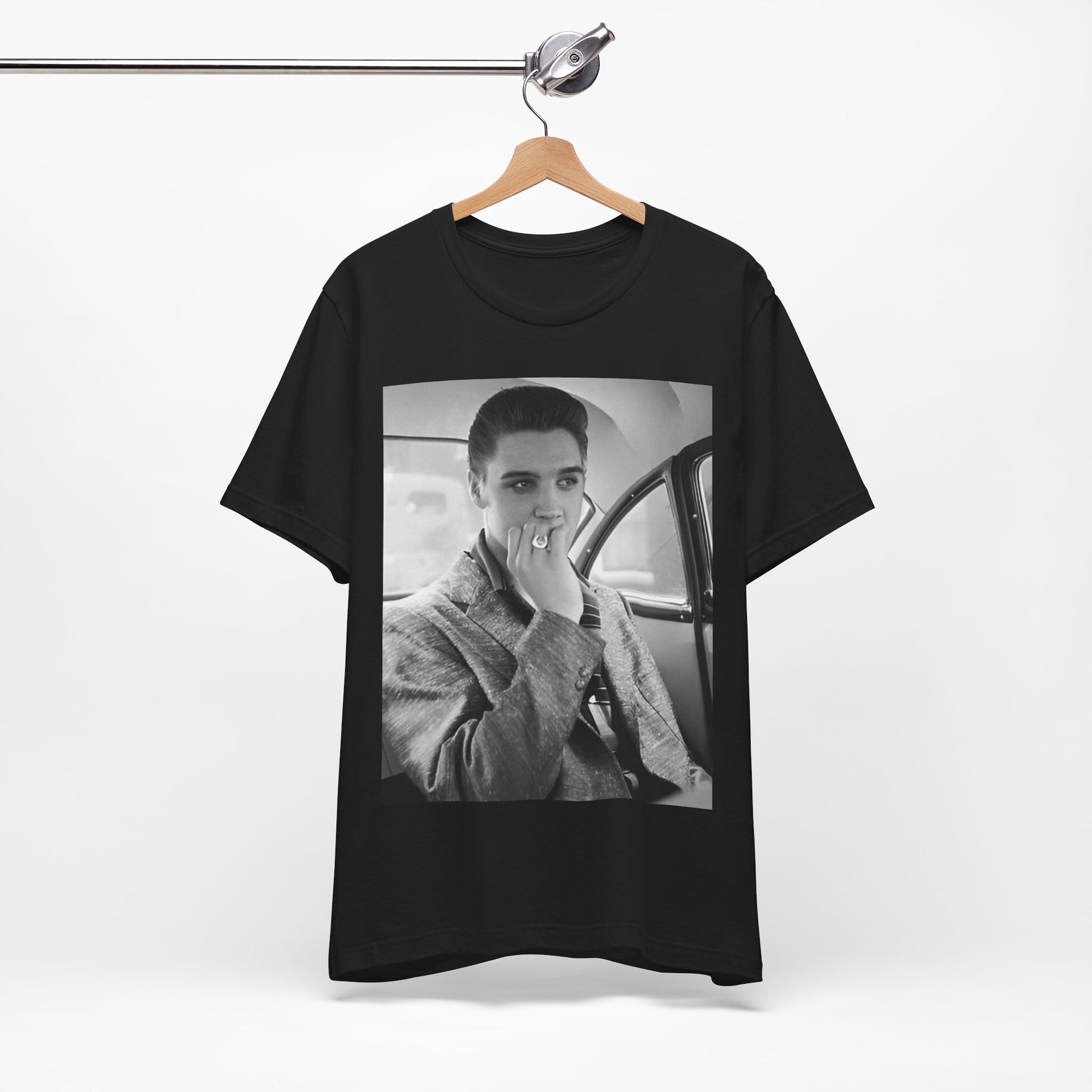 A black graphic t-shirt featuring a classic 50s era graphic of Elvis Presley.
