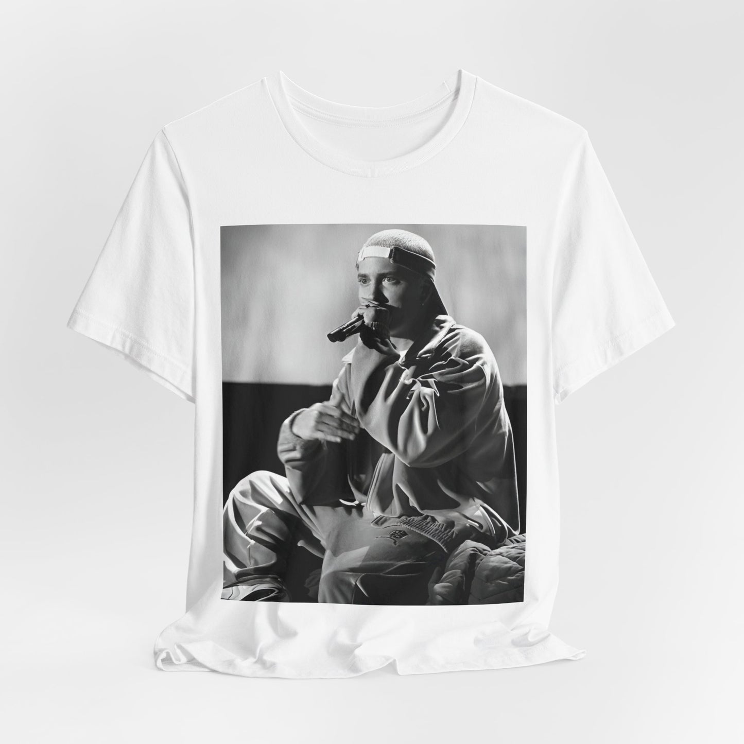 A black graphic t-shirt featuring a black and white graphic of Eminem as a 'Rap Messiah'.