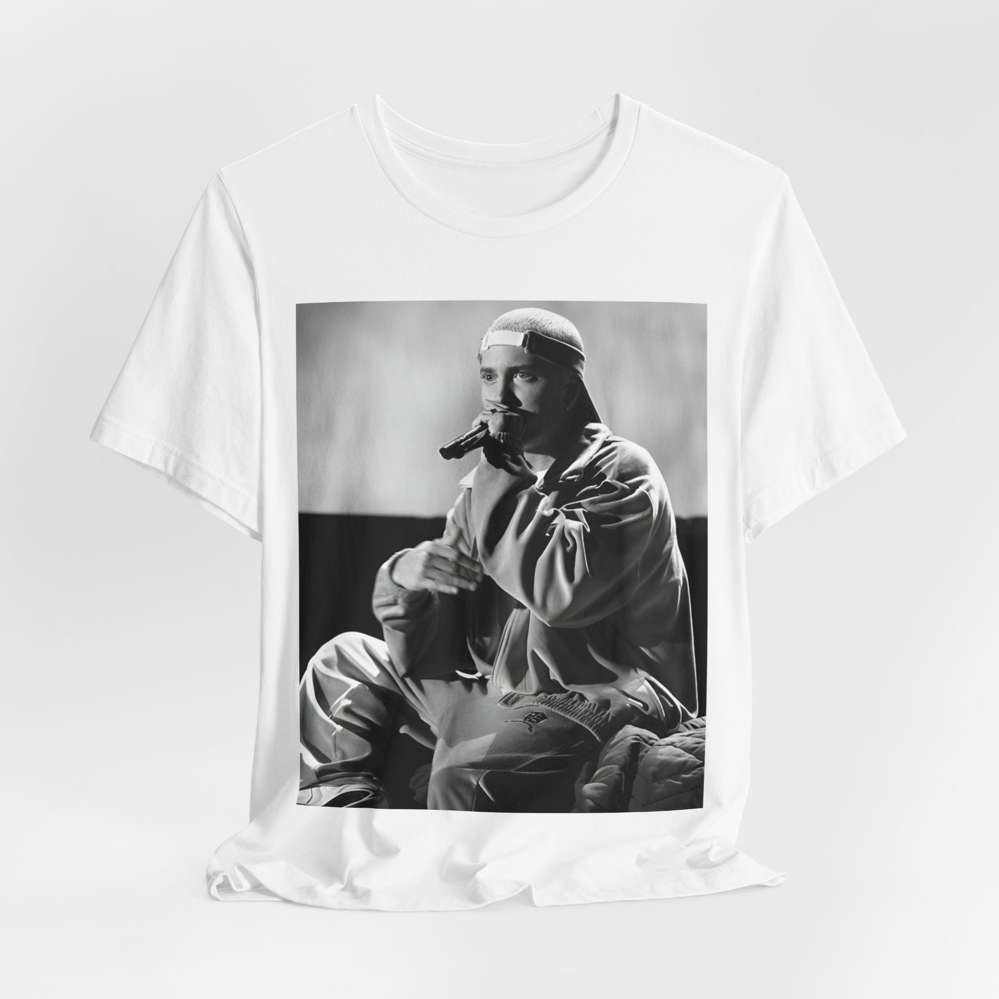 A black graphic t-shirt featuring a black and white graphic of Eminem as a 'Rap Messiah'.