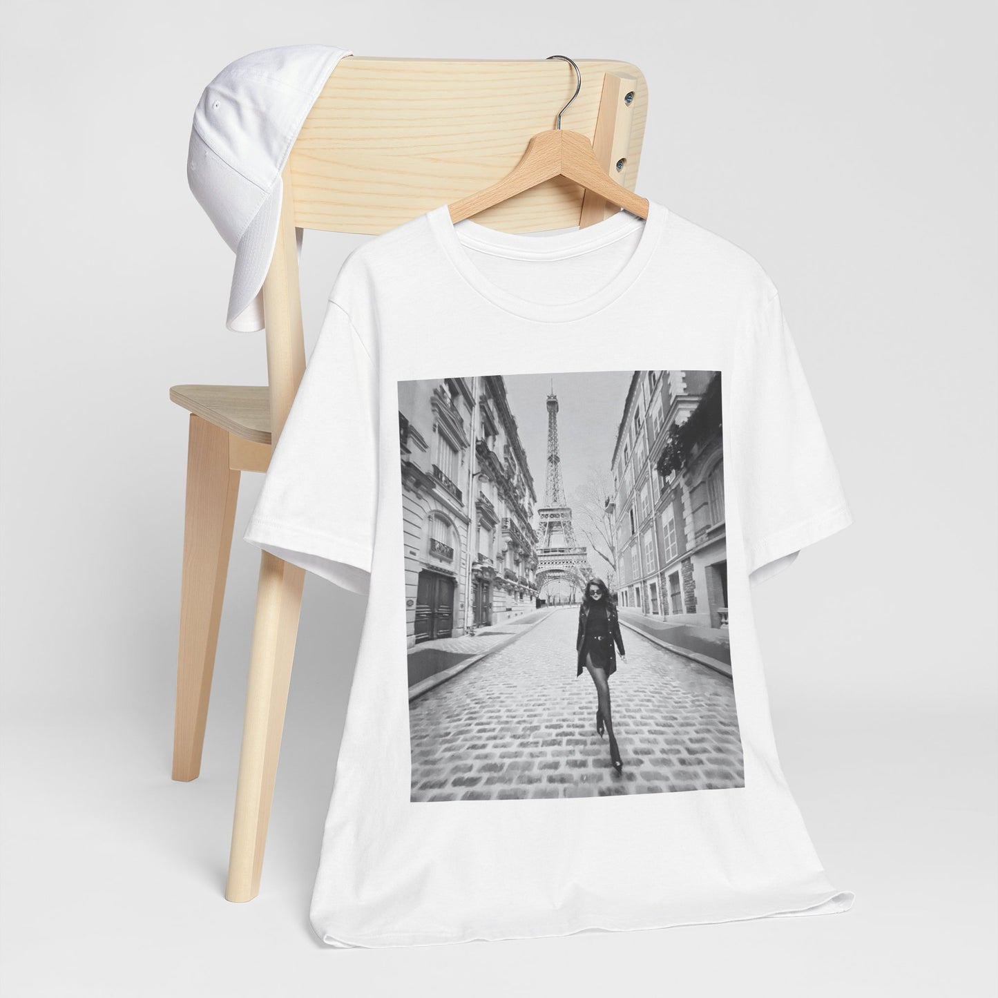 A black graphic t-shirt featuring a black and white photo of Selena Gomez in Paris.
