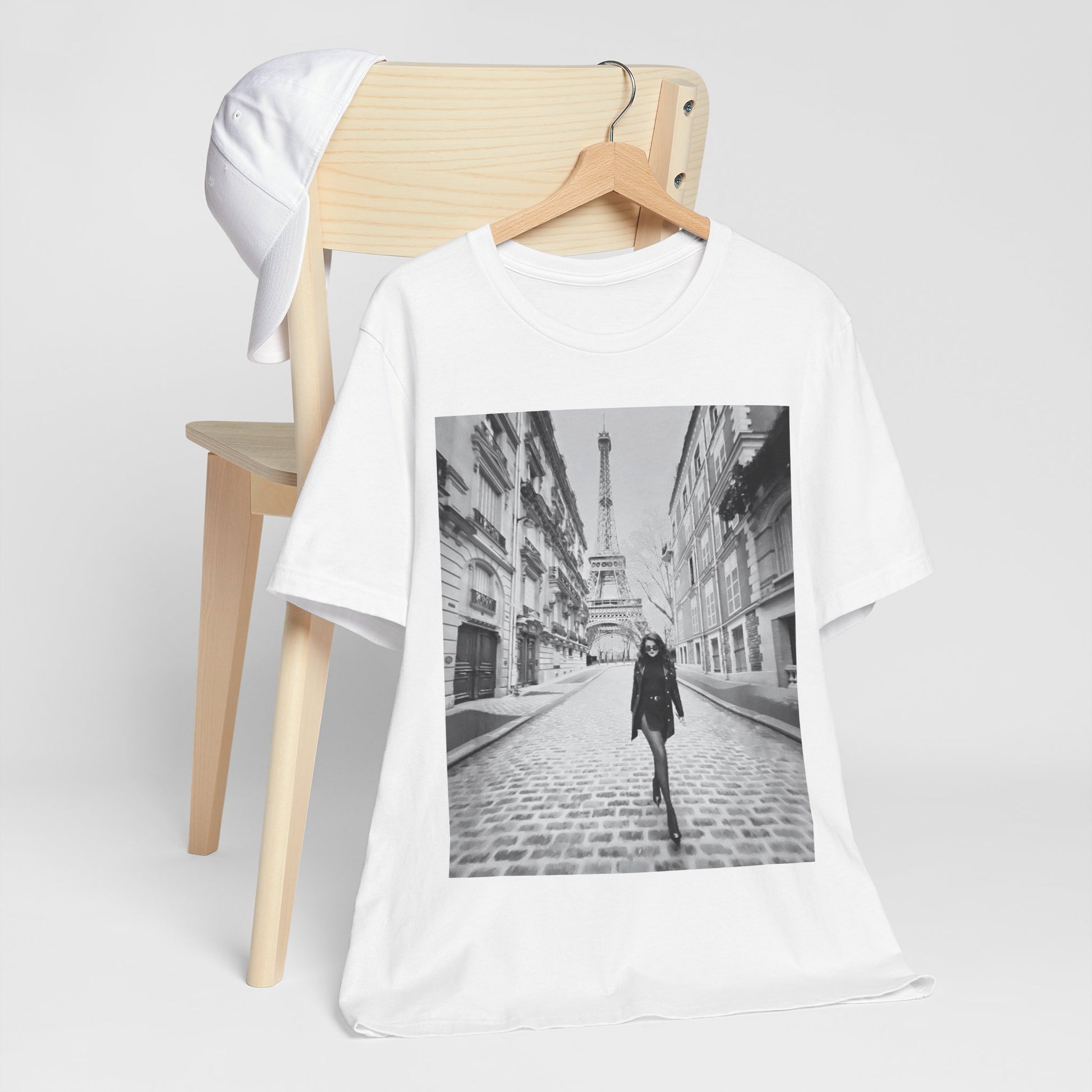 A black graphic t-shirt featuring a black and white photo of Selena Gomez in Paris.