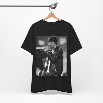 A black graphic t-shirt featuring a classic 90s graphic of Eminem as a 'Rap God'.