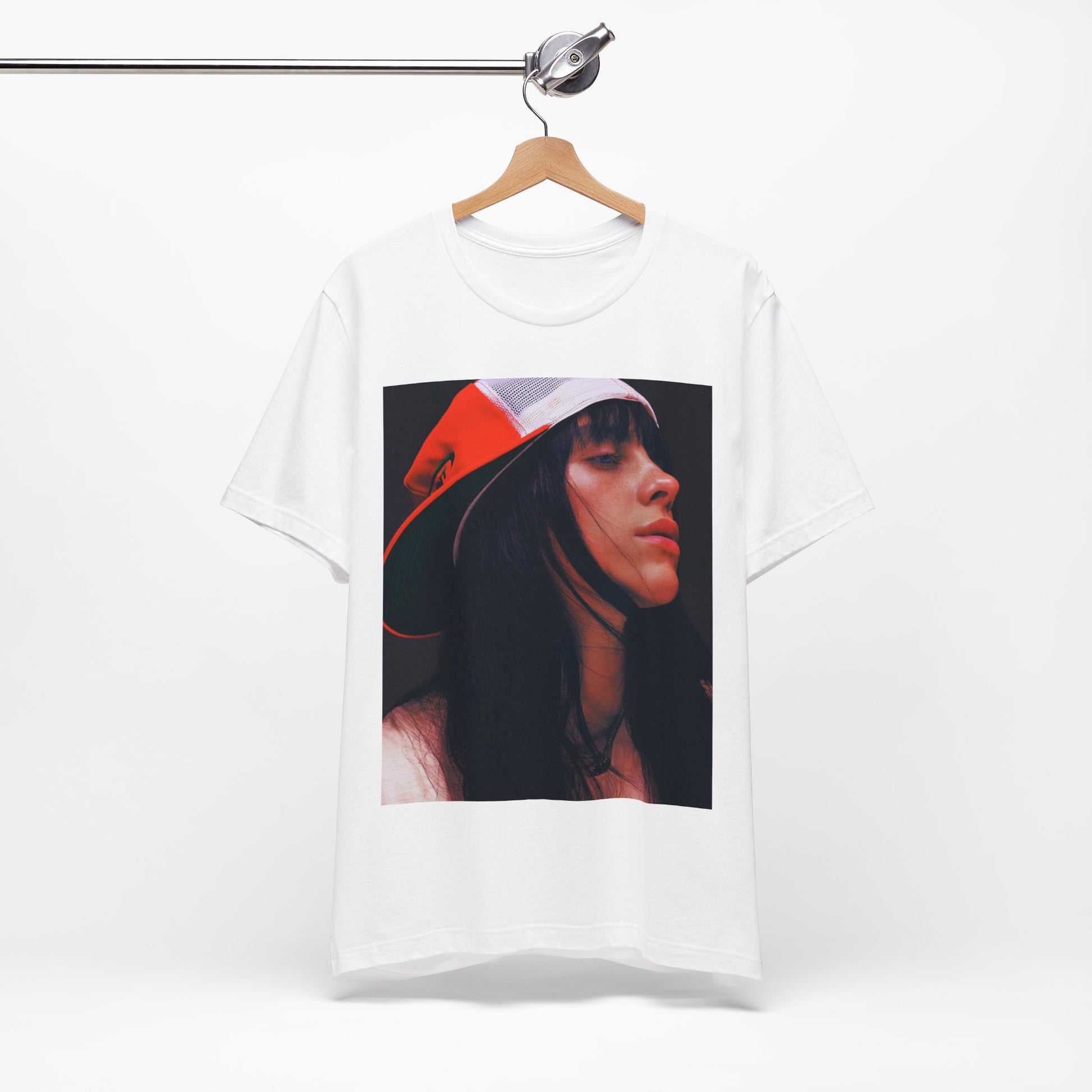 A graphic t-shirt featuring the name 'Billie Eilish' in a raw, urban street-style font.